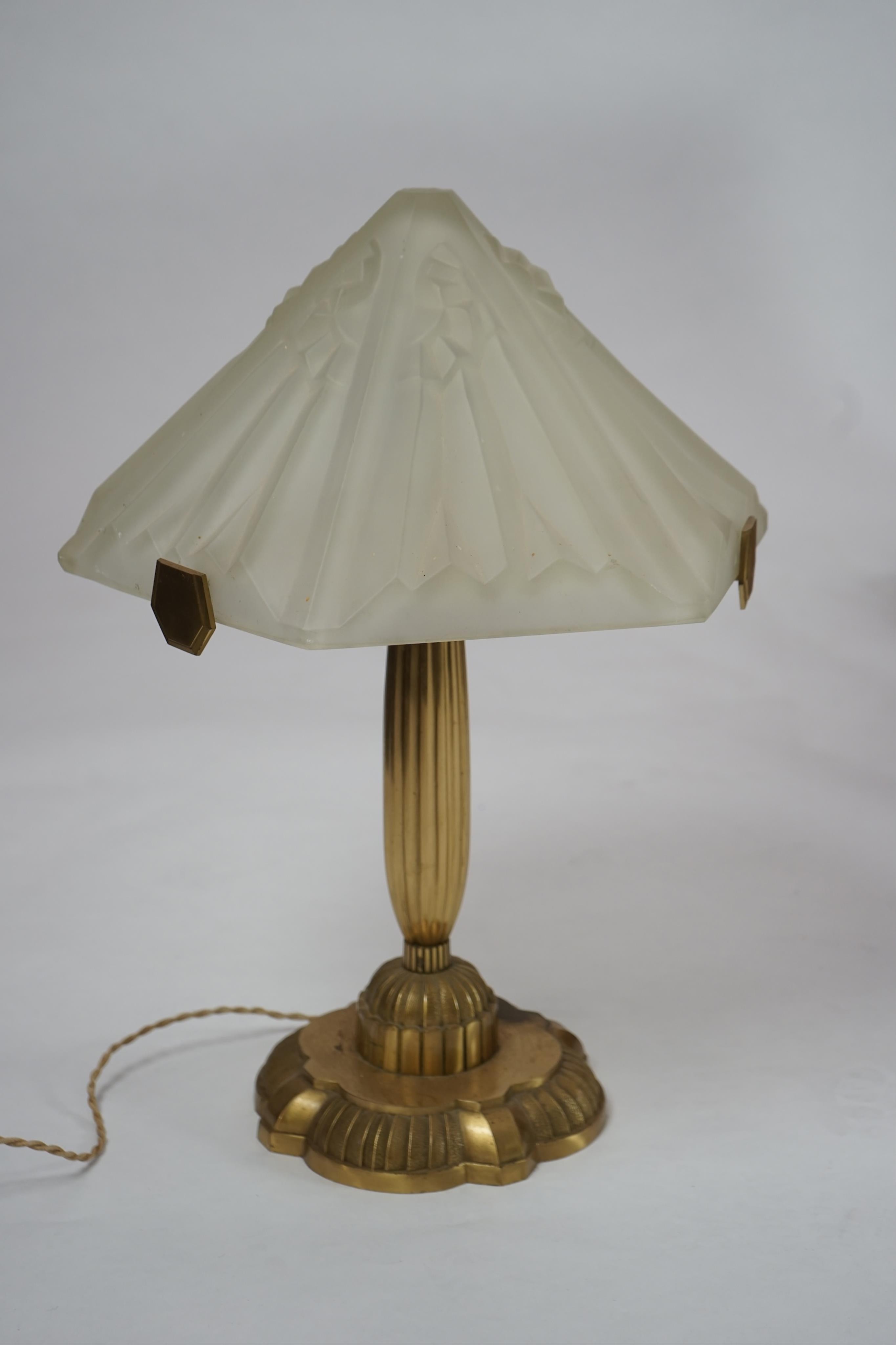 An Art Deco matt gilt brass table lamp with frosted glass shade